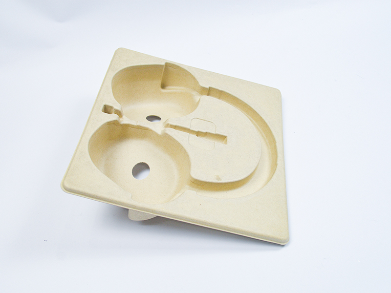 Wet-pressed paper pulp molded packaging made from raw wood pulp