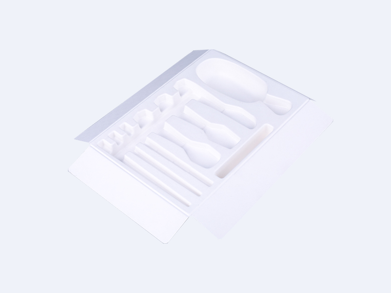 Skin care product packaging with white wet-pressed paper tray and paper-plastic 